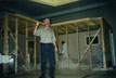 Instructor Byron Ware makes a point as students prepare containment wall for remediation mock up at mold remediation seminar